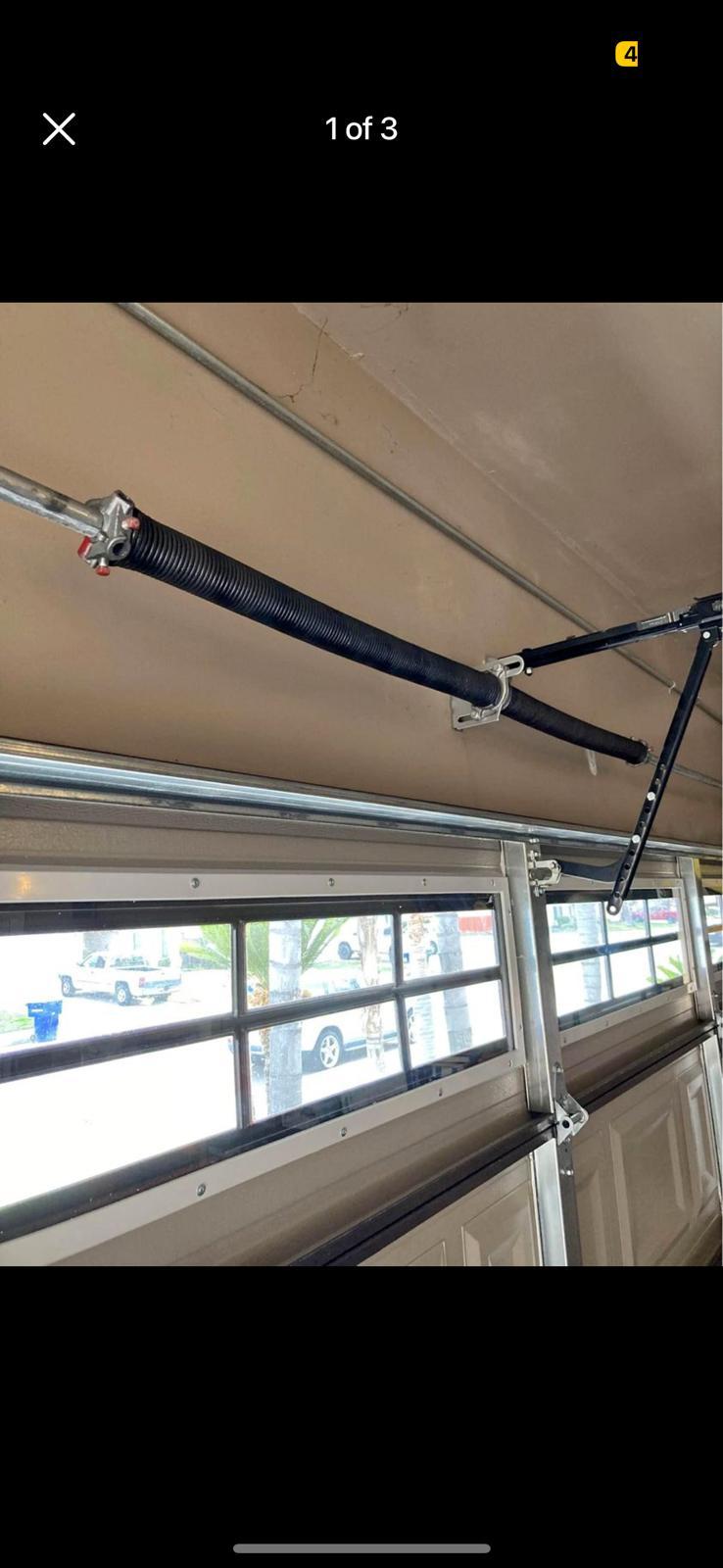 Freshly installed torsion spring on residential door